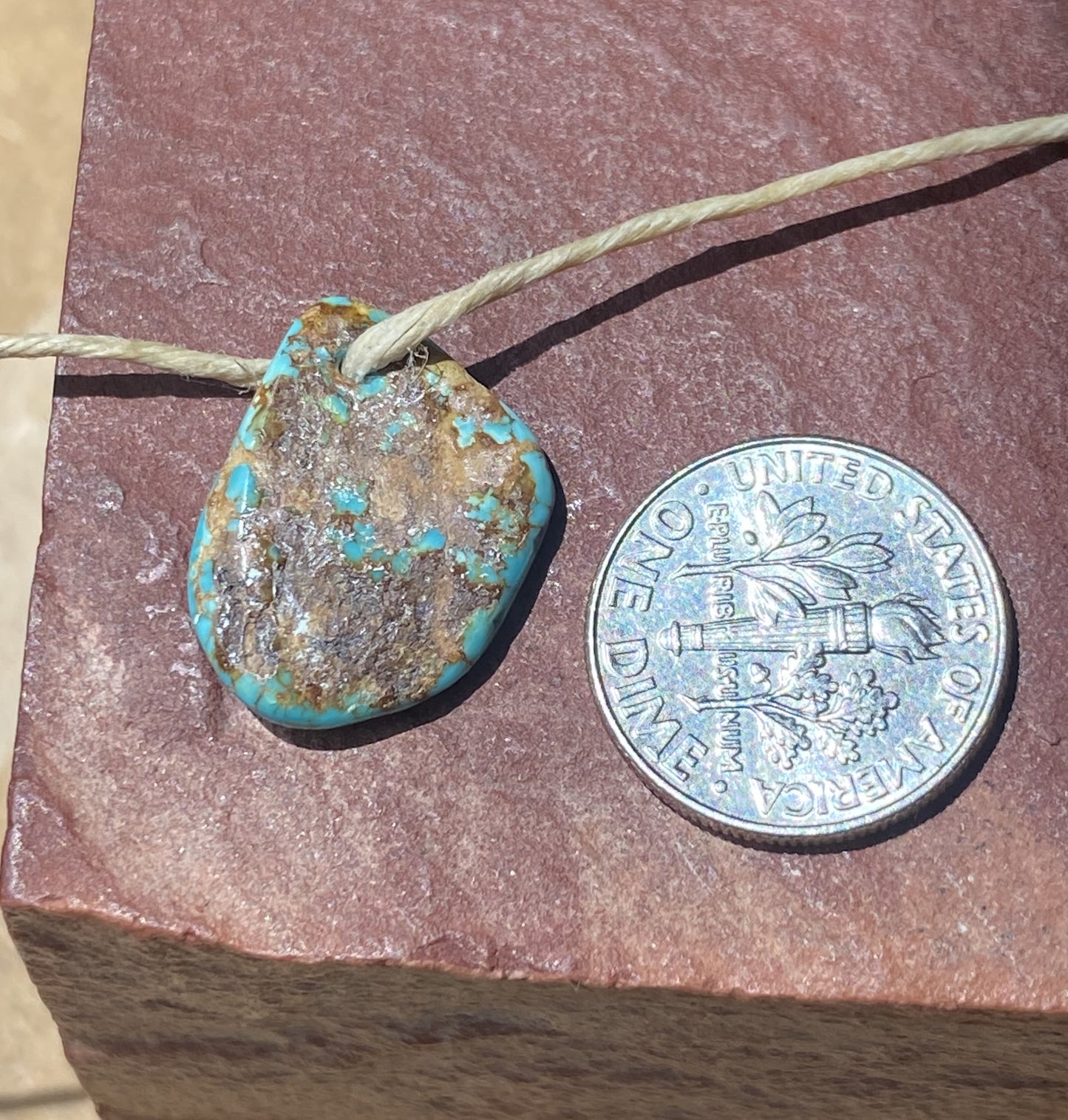 6 carat blue Stone Mountain Turquoise tab style bead with red matrix