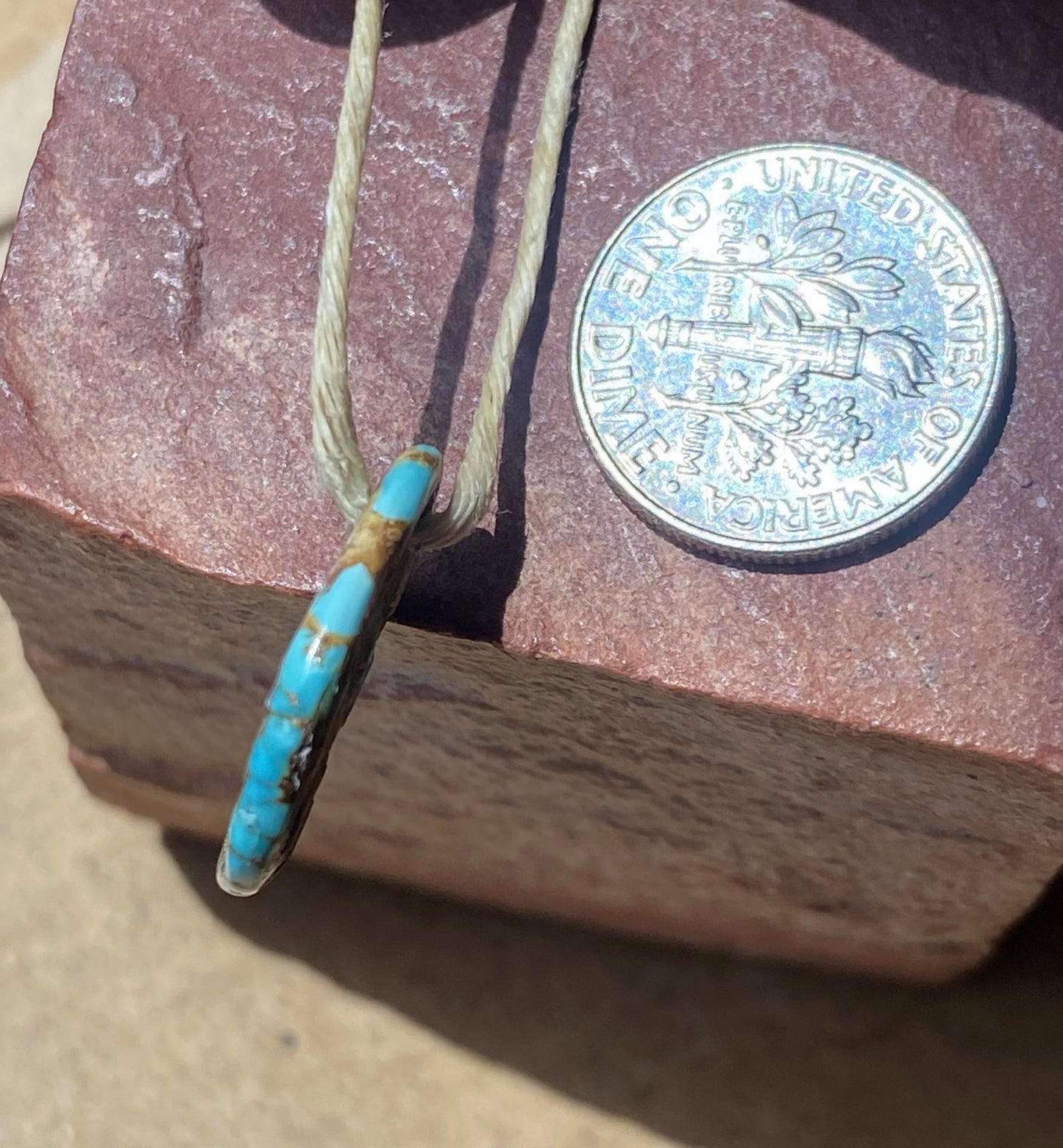 6 carat blue Stone Mountain Turquoise tab style bead with red matrix
