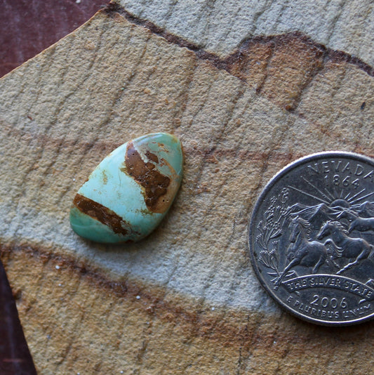 5 carat color change Stone Mountain Turquoise cabochon with red matrix