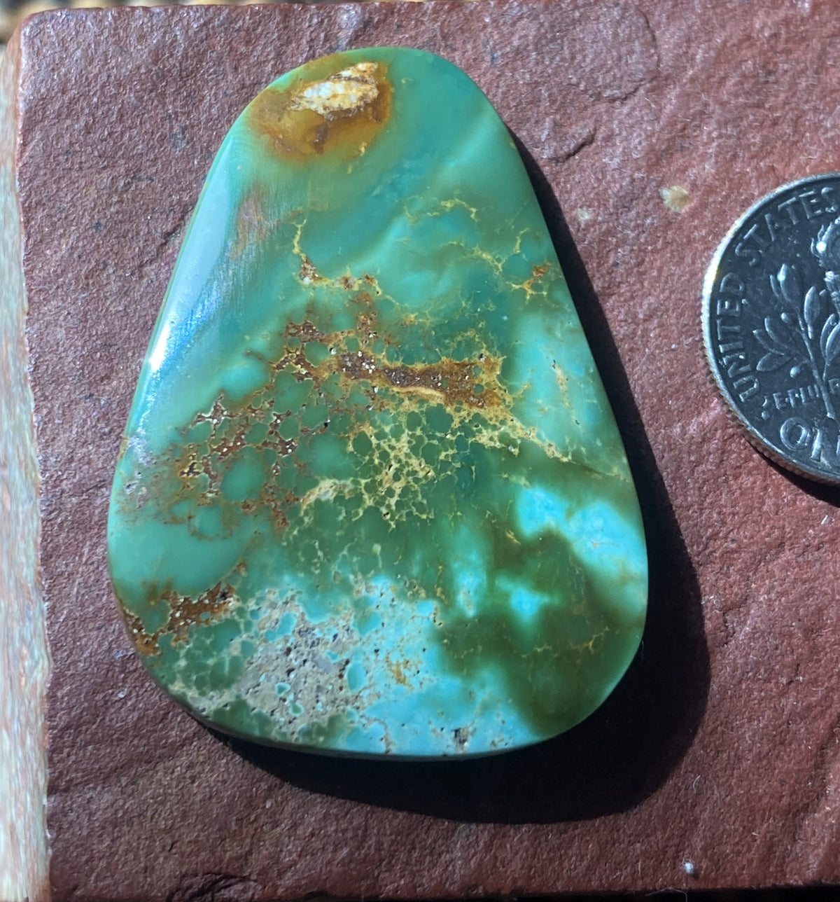 40 carat color change Stone Mountain Turquoise cabochon with red matrix