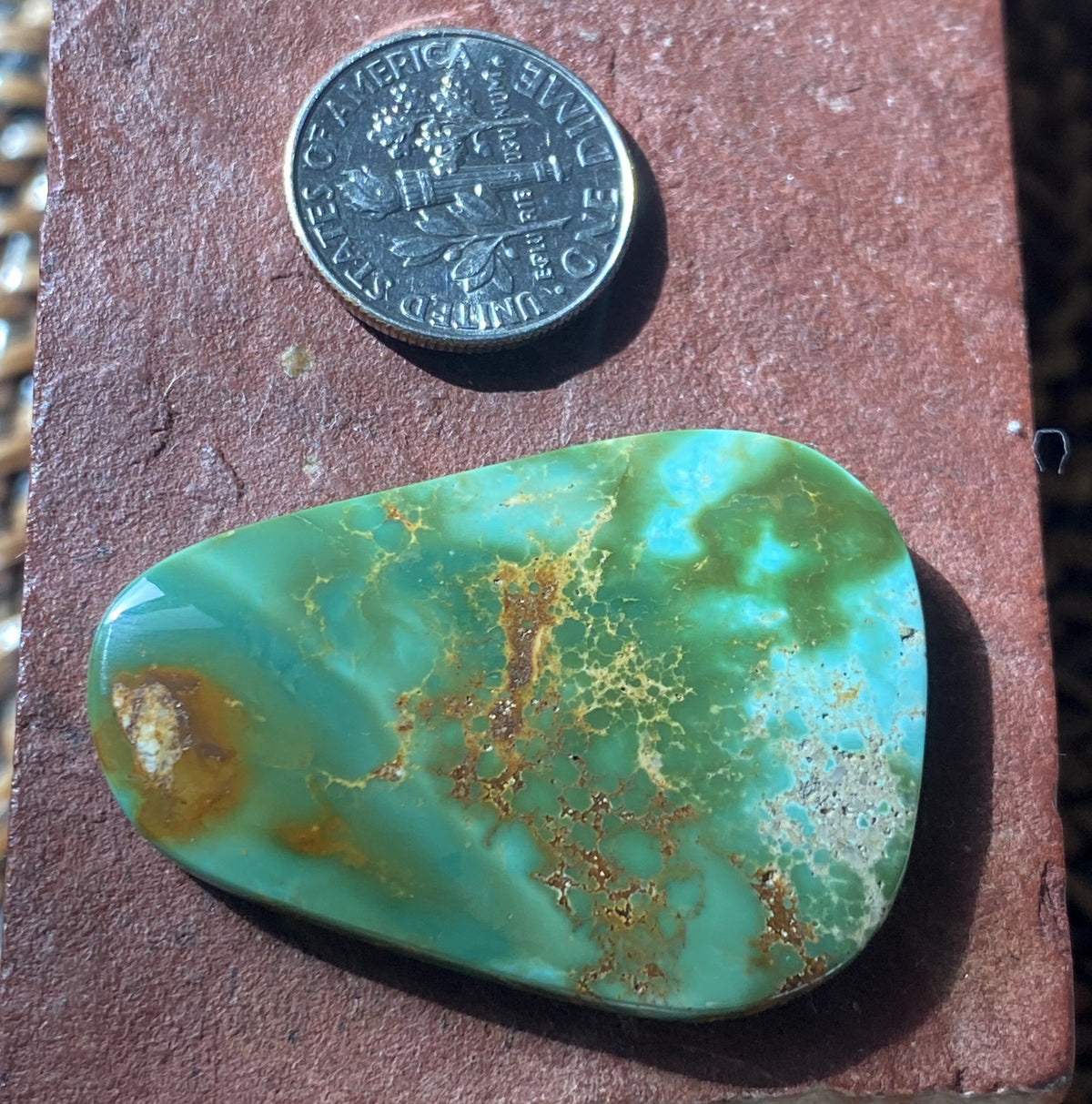 40 carat color change Stone Mountain Turquoise cabochon with red matrix