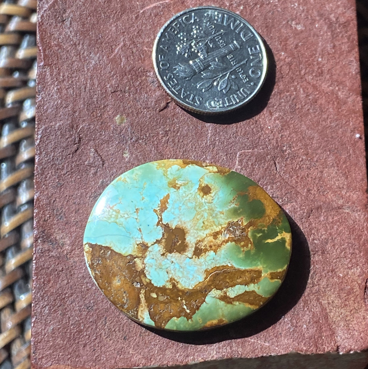 25 carat color change Stone Mountain Turquoise cabochon oval with red matrix