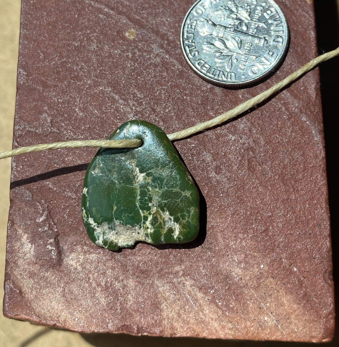 10 carat dark green turquoise tab style bead from Stone Mountain Mine