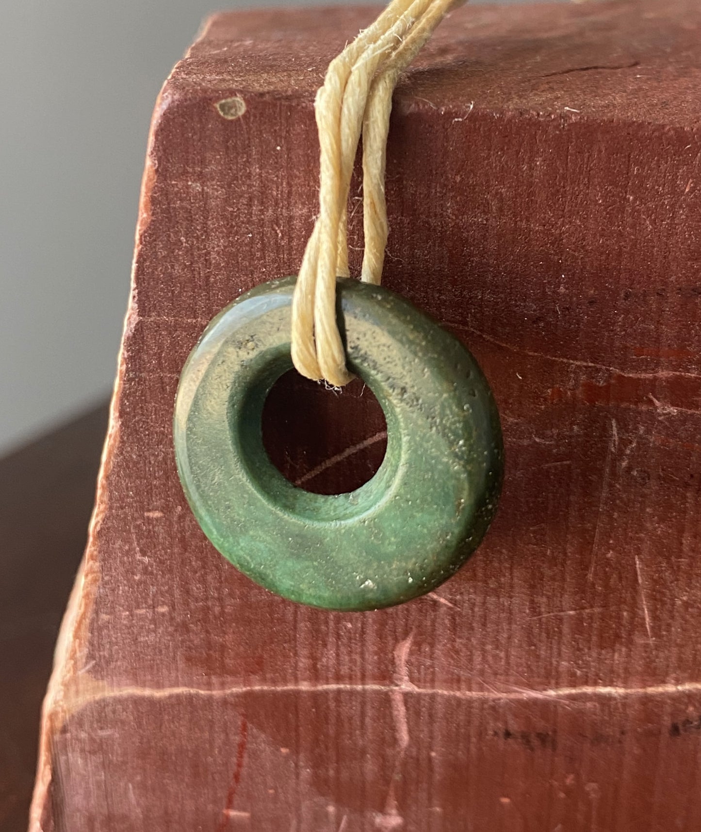10 carat dark green turquoise disc bead from Stone Mountain Mine