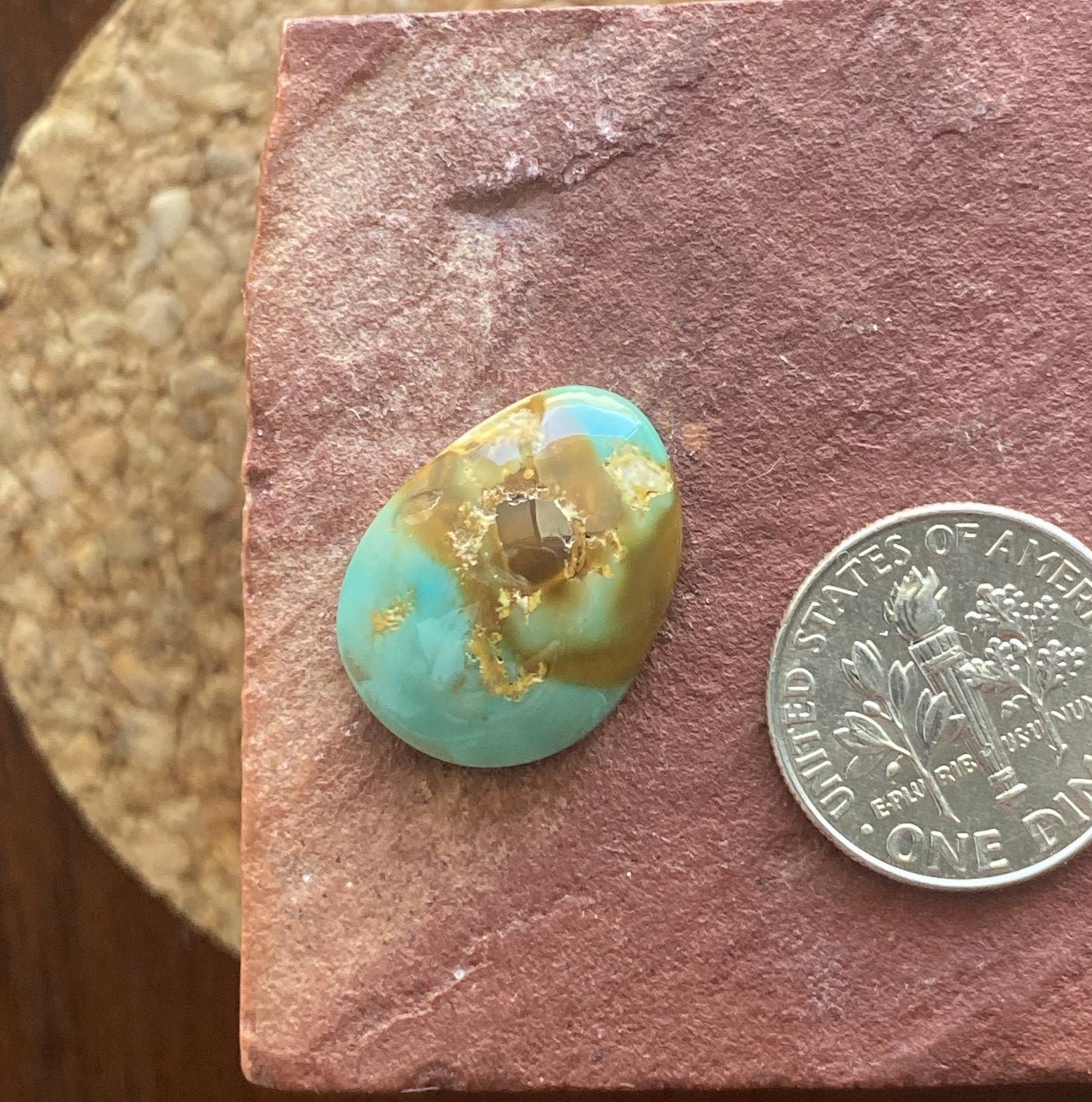 9 carat blue Stone Mountain Turquoise cabochon with red inclusions and a high dome