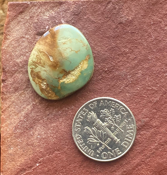 13 carat green Stone Mountain Turquoise cabochon with red inclusions