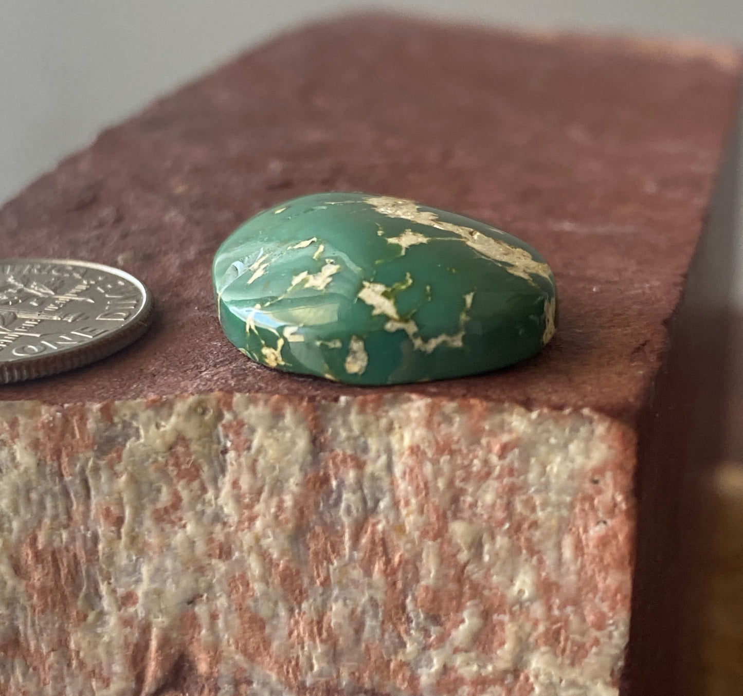 22 carat green Stone Mountain Turquoise cabochon with a high dome