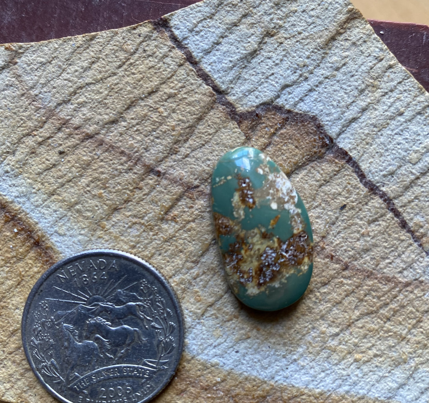14 carat green Stone Mountain Turquoise cabochon with red matrix