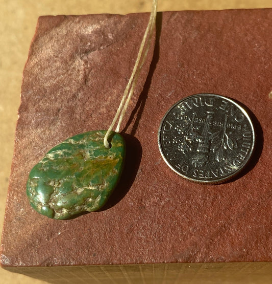 7 carat dark green Stone Mountain Turquoise tab style bead with inclusions