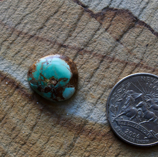 9 carat teal green Stone Mountain Turquoise cabochon with red matrix
