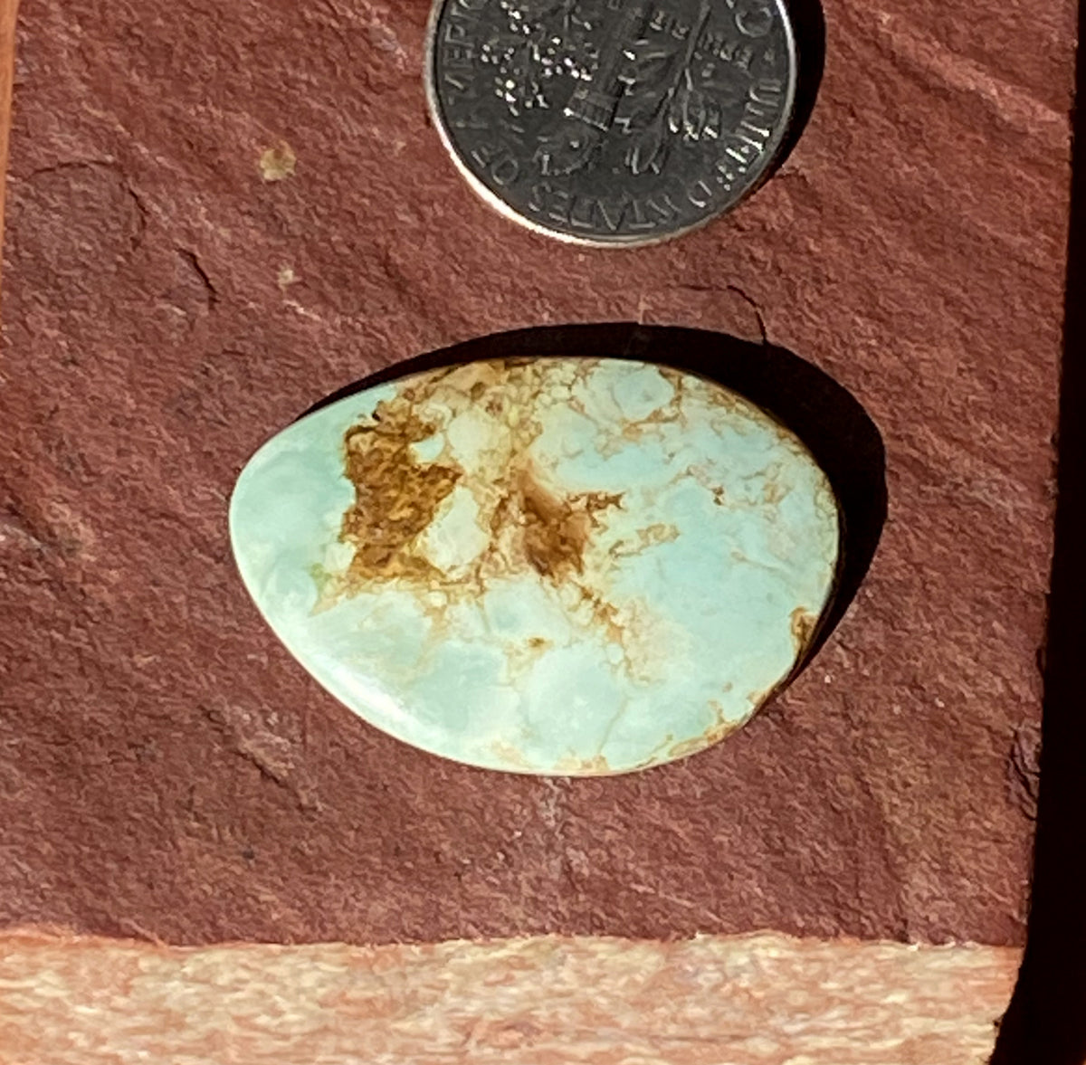 14 carats natural light blue boulder-cut Stone Mountain Turquoise cabochon with iron inclusions