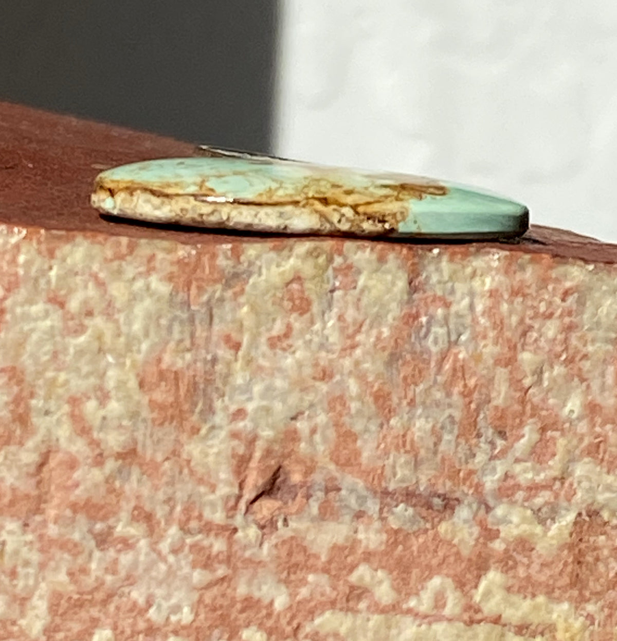 14 carats natural light blue boulder-cut Stone Mountain Turquoise cabochon with iron inclusions