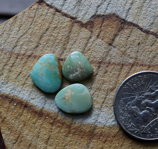 A trio of light green Stone Mountain Turquoise cabochons