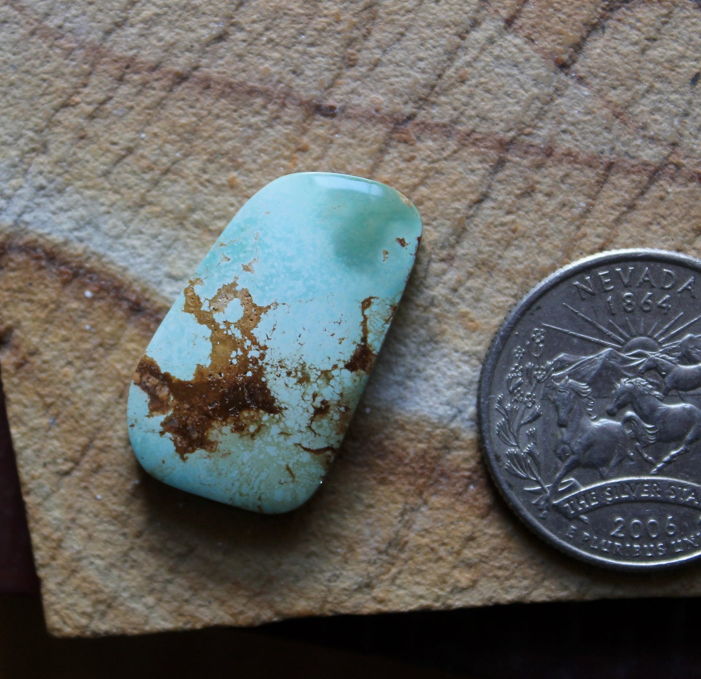 20 carat color change Stone Mountain Turquoise cabochon with red matrix