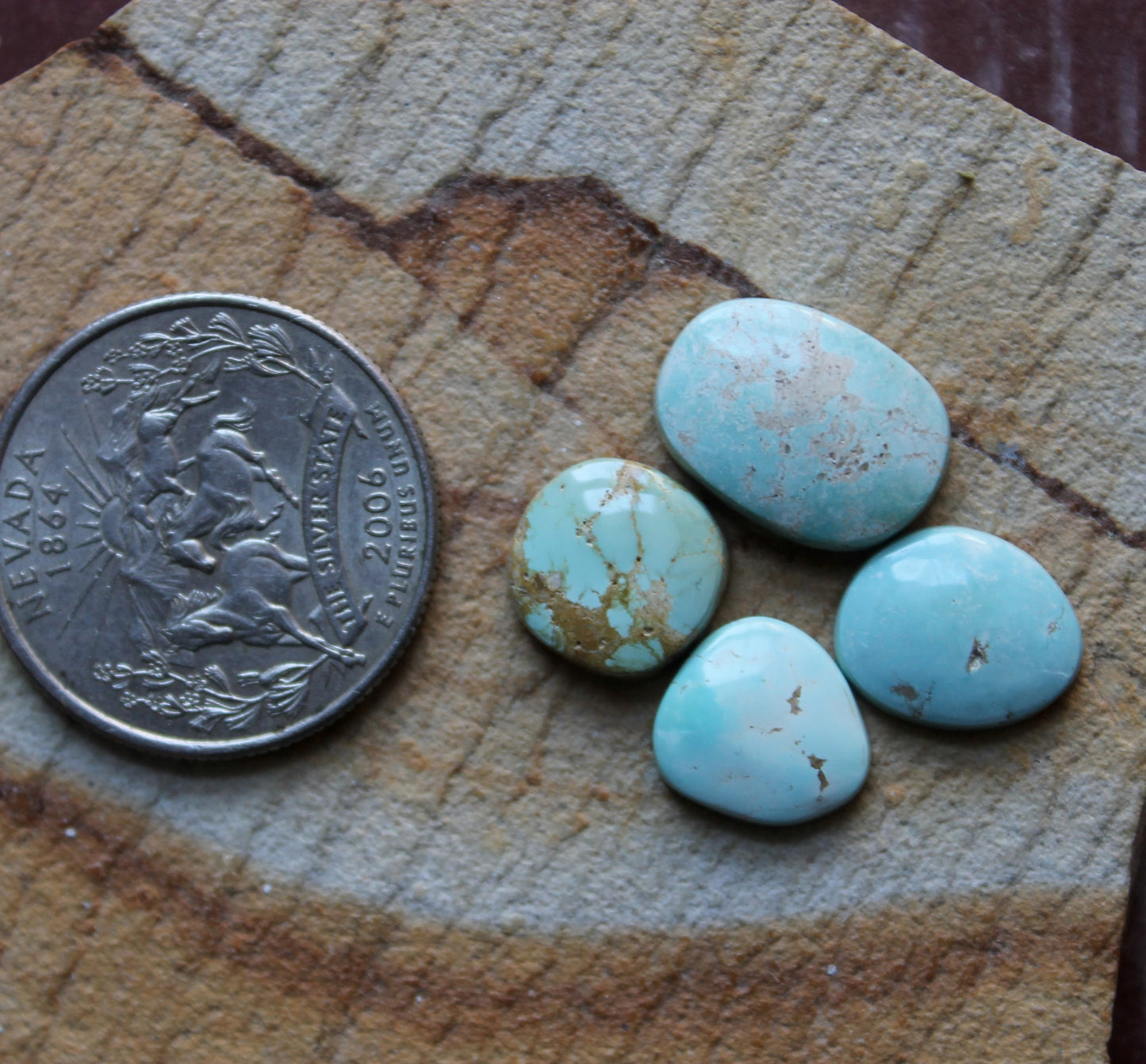 A mix of light blue Stone Mountain Turquoise cabochons