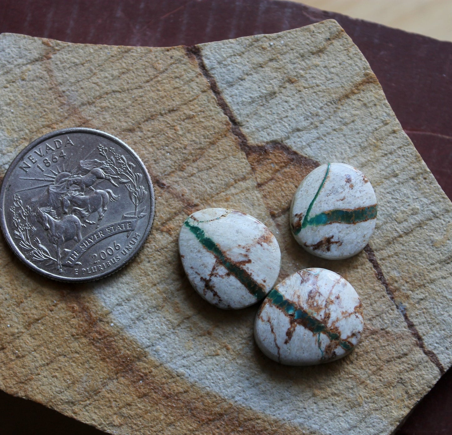 A trio of boulder-cut Stone Mountain Turquoise cabochons