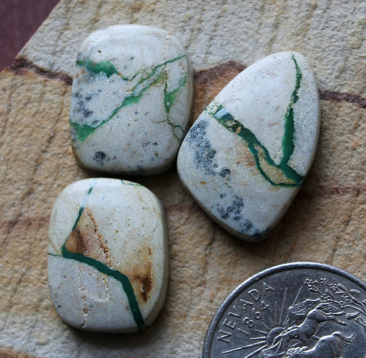 A boulder-cut trio of Stone Mountain Turquoise cabochons