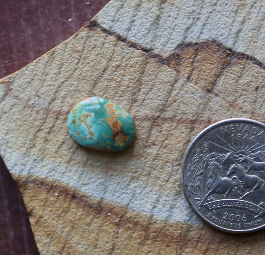 4 carat teal blue Stone Mountain Turquoise cabochon with red matrix
