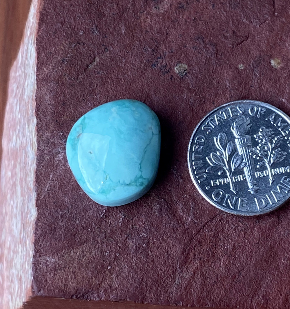 10 carat light green natural Tonopah cabochon with a high dome
