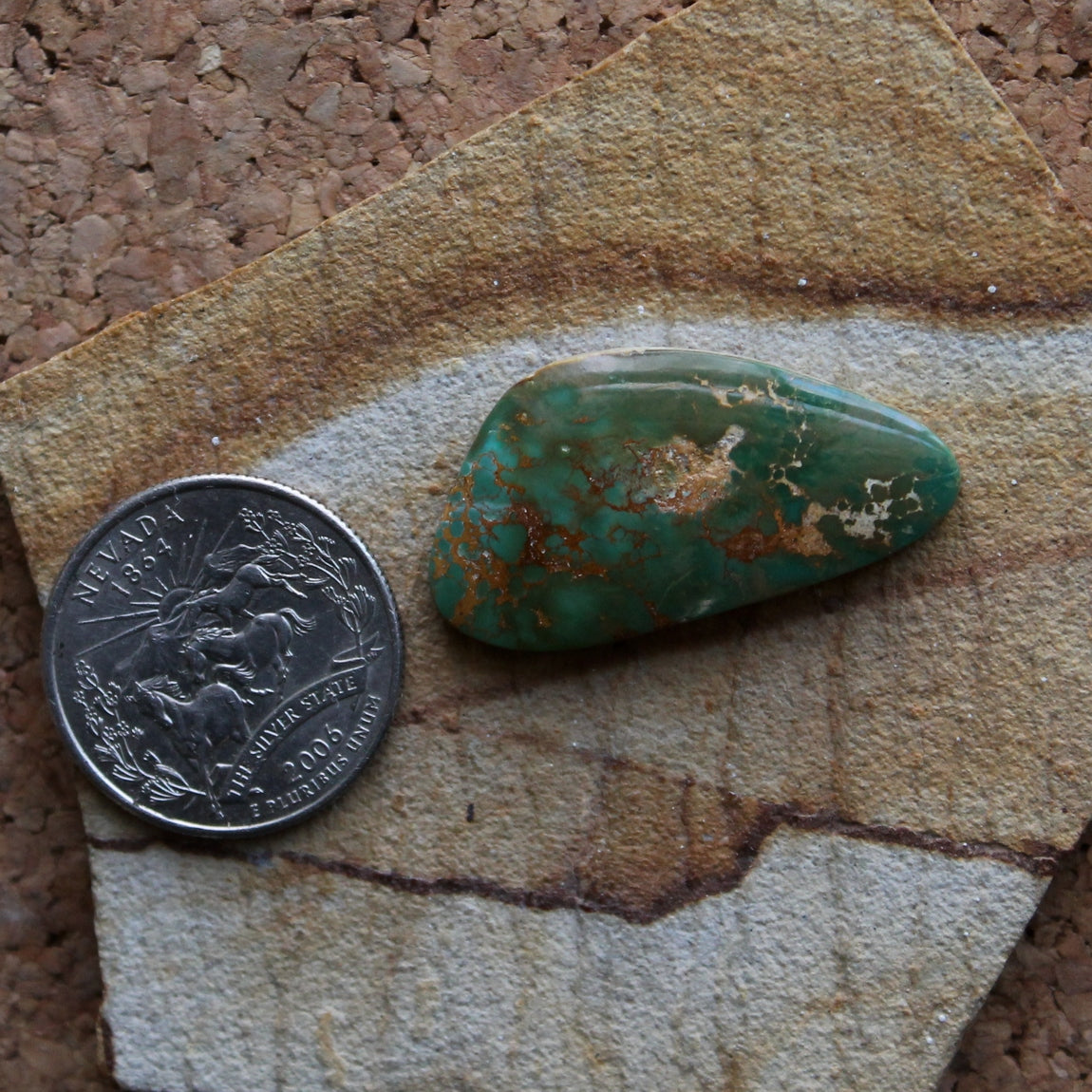 21.6 carat green Stone Mountain Turquoise cabochon with red matrix