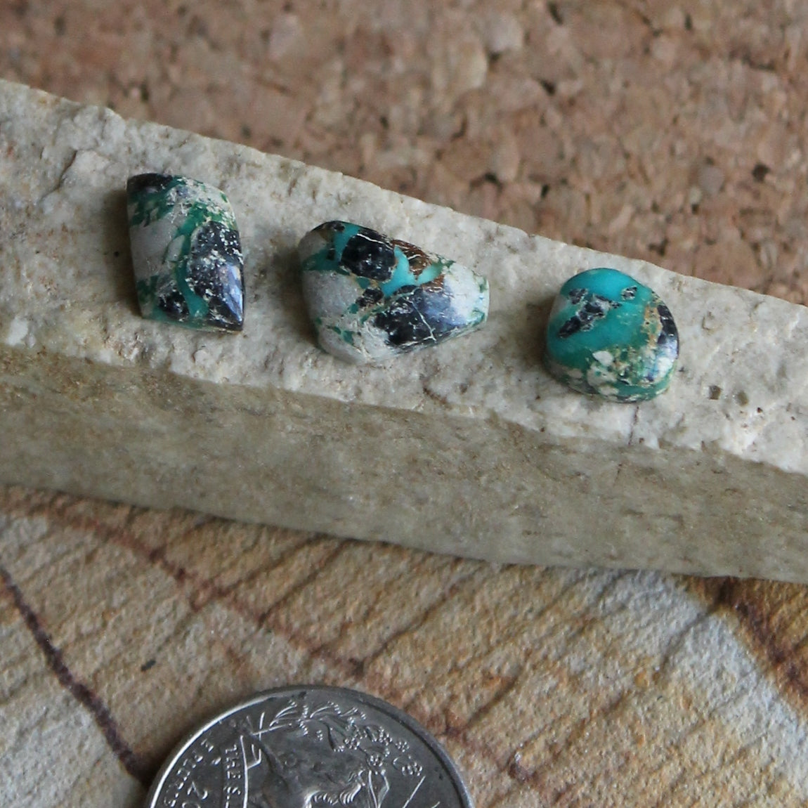 A trio of Stone Mountain Turquoise boulder-cut cabochon with rare matrix