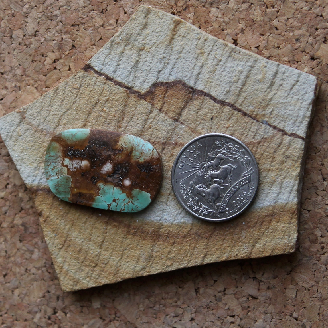 21.9 carat green contrasted by red on this Stone Mountain Turquoise cabochon
