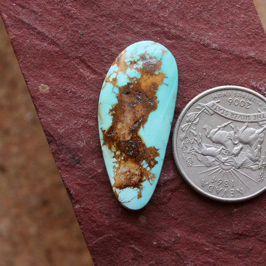 16 carat blue Stone Mountain Turquoise cabochon with red matrix