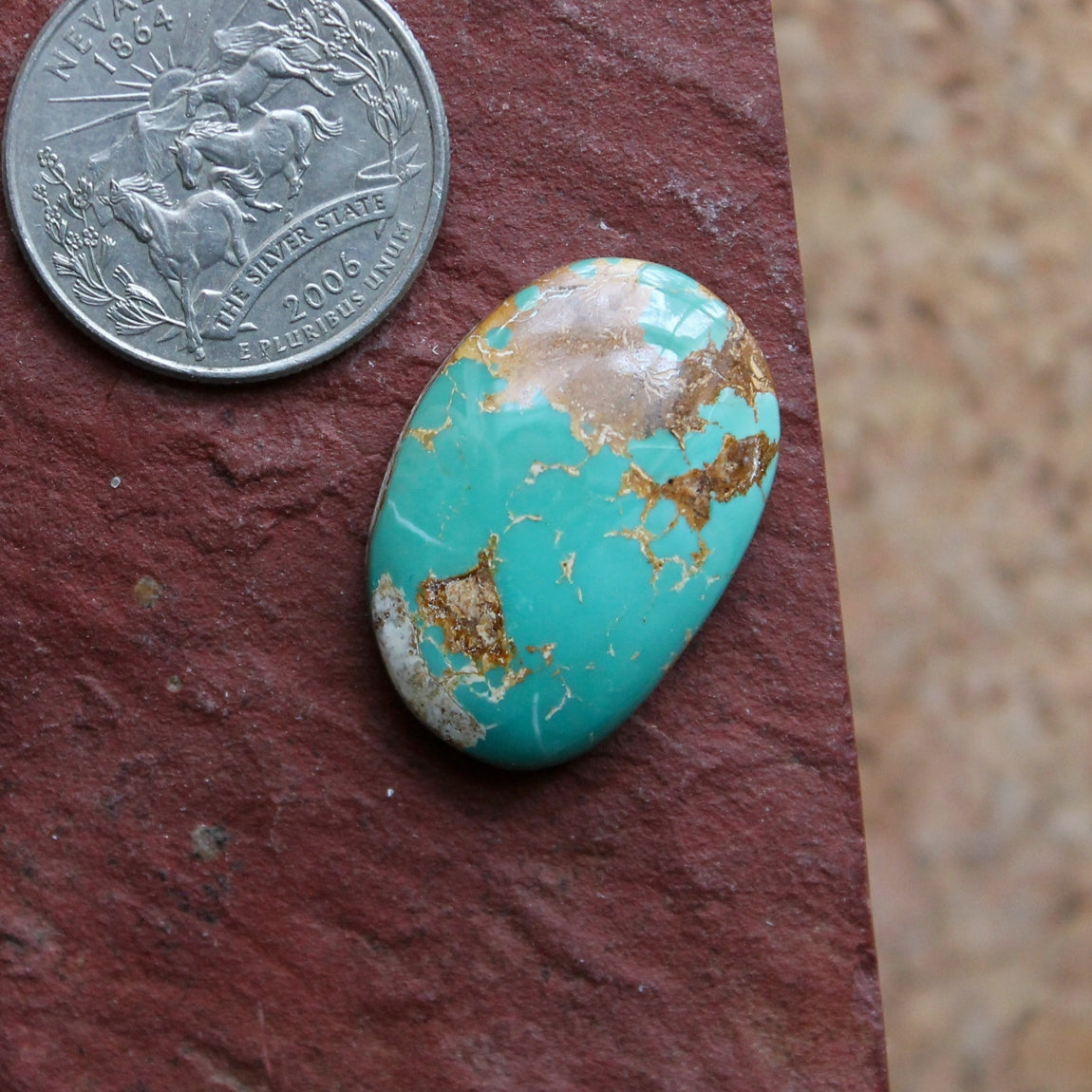 24 carat blue-teal Stone Mountain Turquoise cabochon with red matrix
