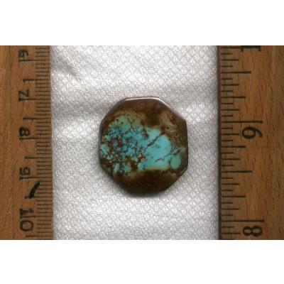 A lovely blue turquoise cabochon with red spiderweb matrix from Stone Mountain Mine.