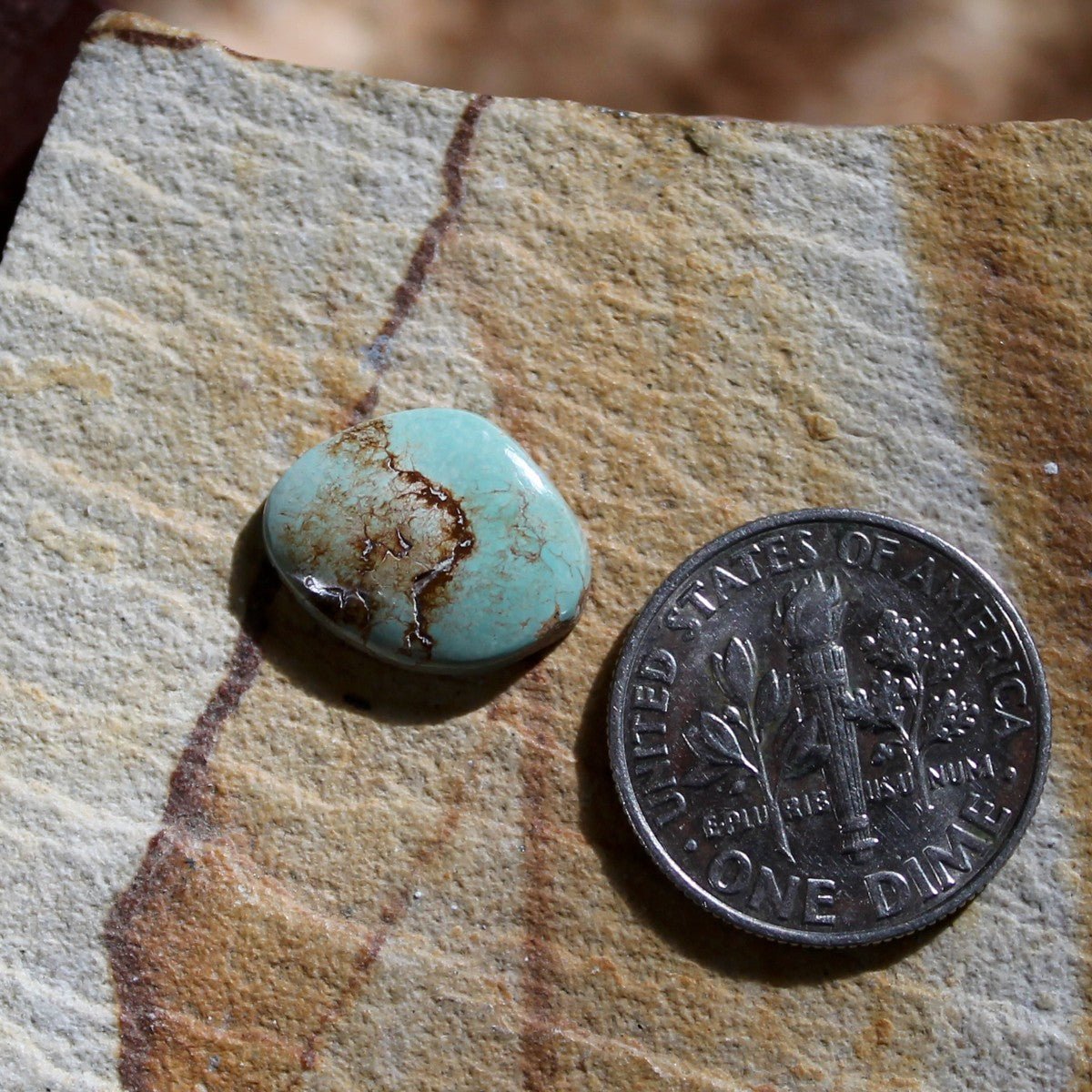 3.3 carat light blue Stone Mountain Turquoise cabochon with red matrix