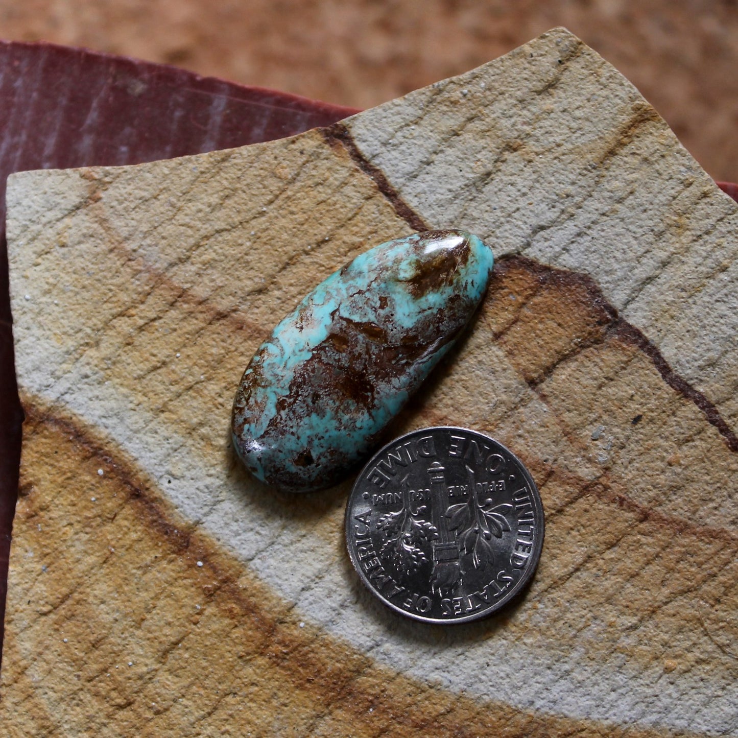 13.7 carat blue Stone Mountain Turquoise cabochon with red matrix