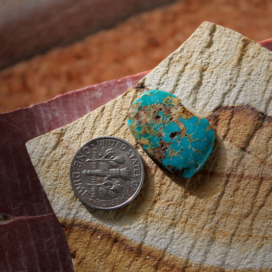 8.4 carat dark blue Stone Mountain Turquoise cabochon with red matrix