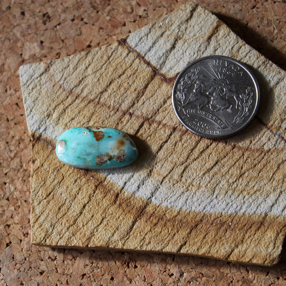 9.9 carat blue Stone Mountain Turquoise cabochon with red inclusions