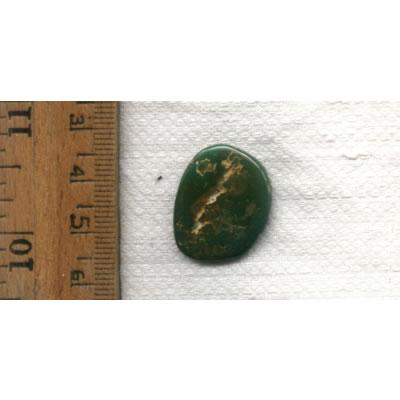 A green turquoise cabochon from Stone Mountain Mine, designed by Nevada Cassidys