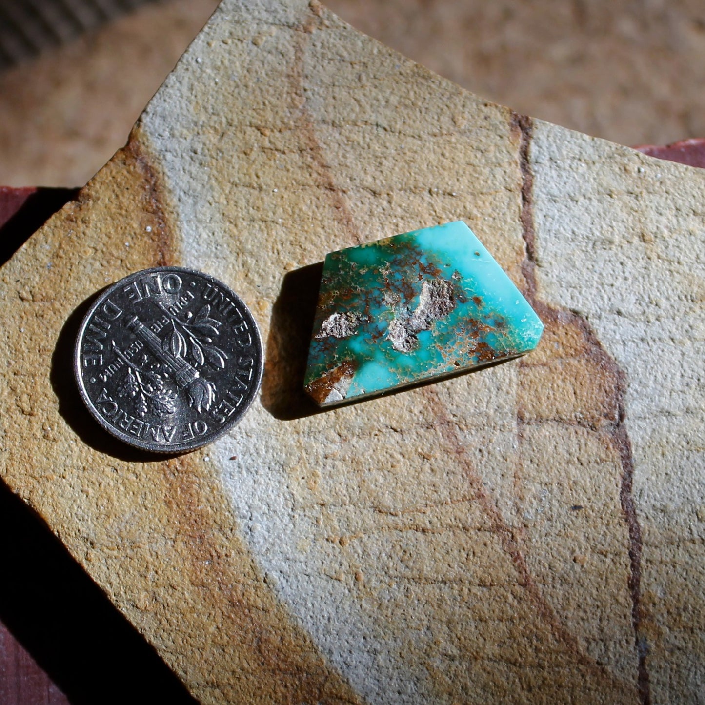 9.6 carat angular blue Stone Mountain Turquoise cabochon with red matrix