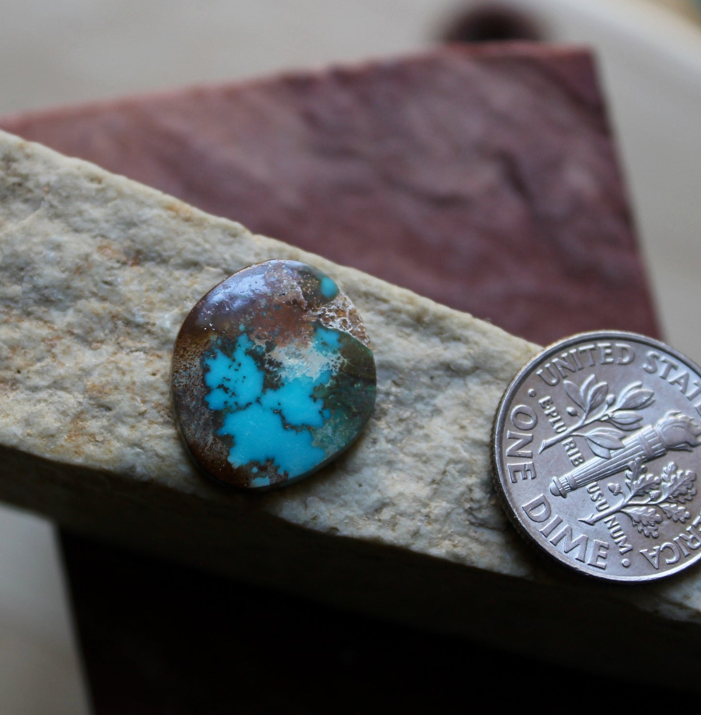 4 carat blue Stone Mountain Turquoise cabochon with red inclusions