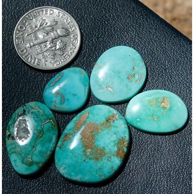 5 natural turquoise nuggets from Blue June fashioned into a lovely medium-blue turquoise cabochon suite.