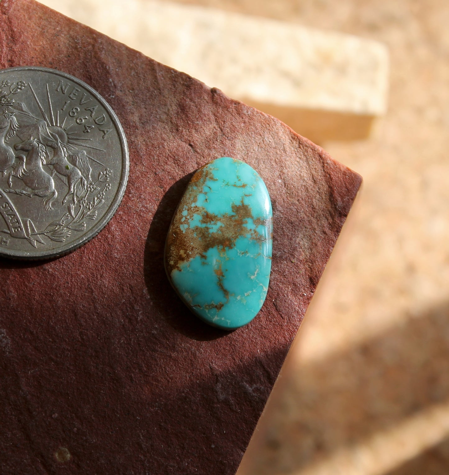 7 carat blue Stone Mountain Turquoise cabochon with red inclusions