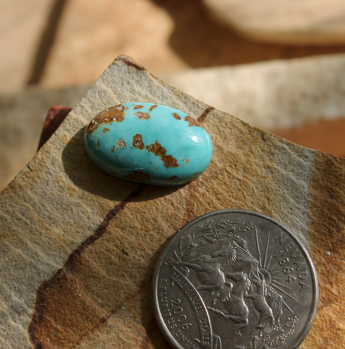 11 carat blue Stone Mountain Turquoise cabochon oval with red matrix