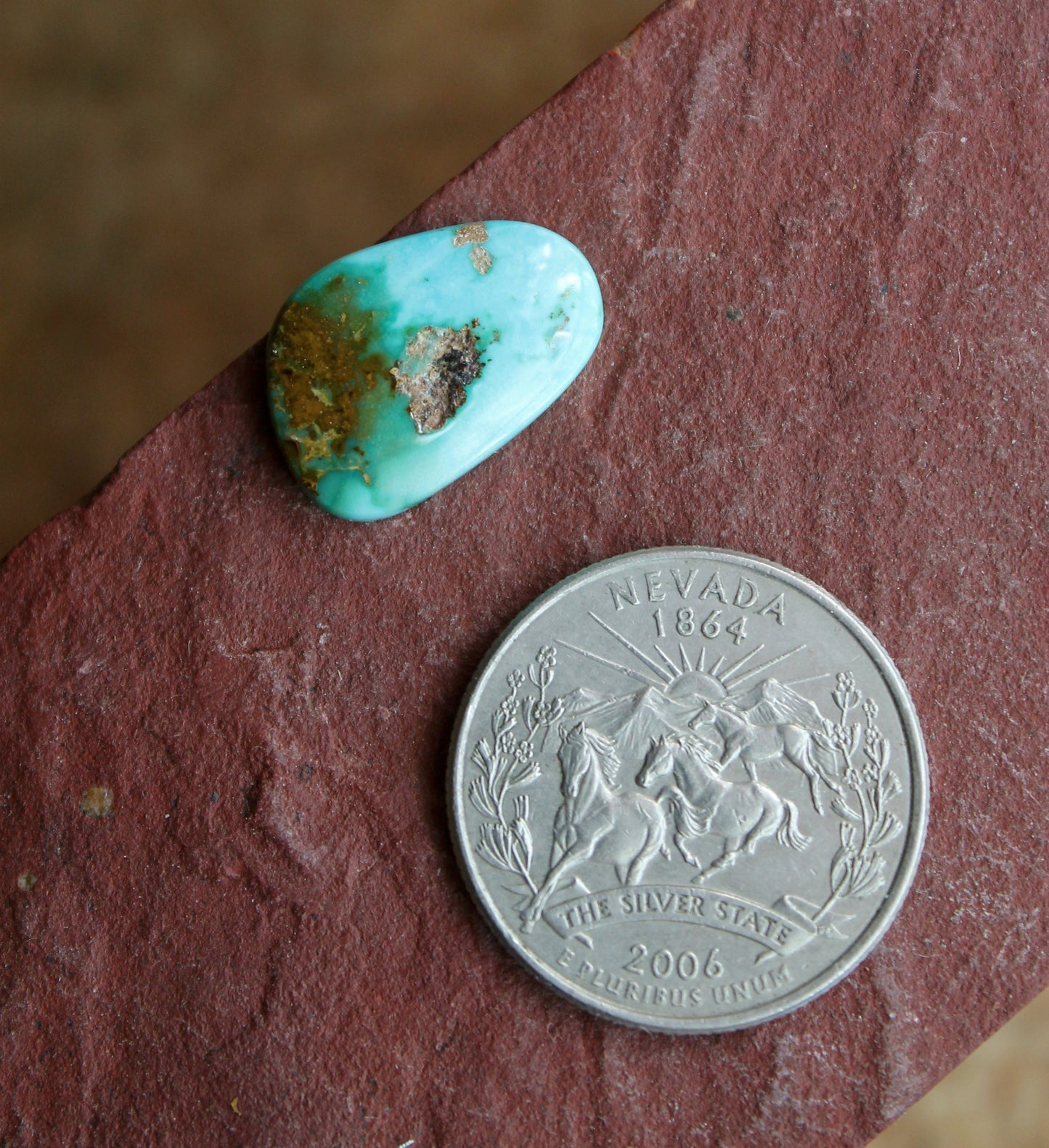 6 carat color blue Stone Mountain Turquoise cabochon with red inclusions