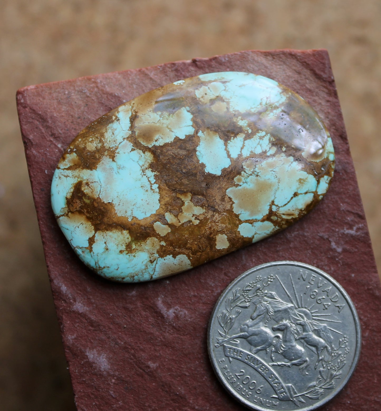 46 carat blue turquoise cabochon from Stone Mountain Mine with red matrix