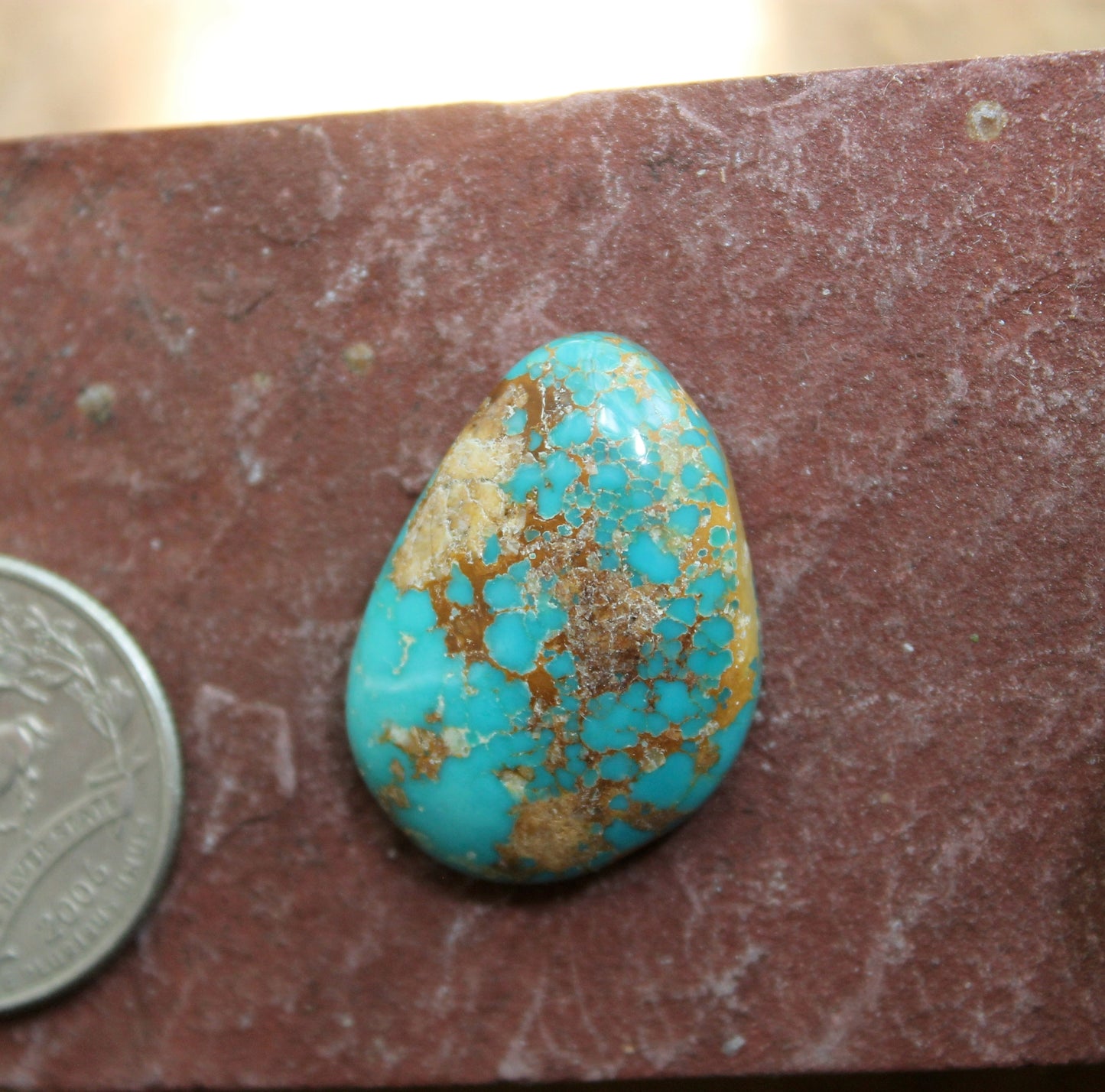 28 carat dark blue Stone Mountain Turquoise cabochon with red matrix