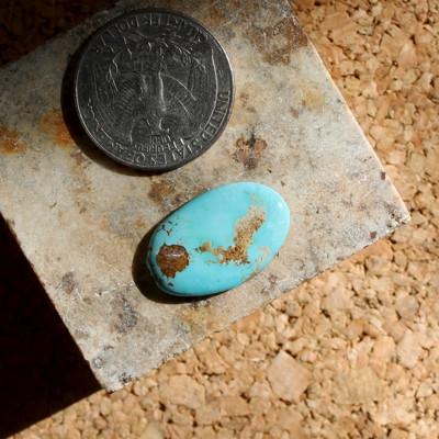 Sky blue contrasts red and tan on this Stone Mountain Turquoise cabochon