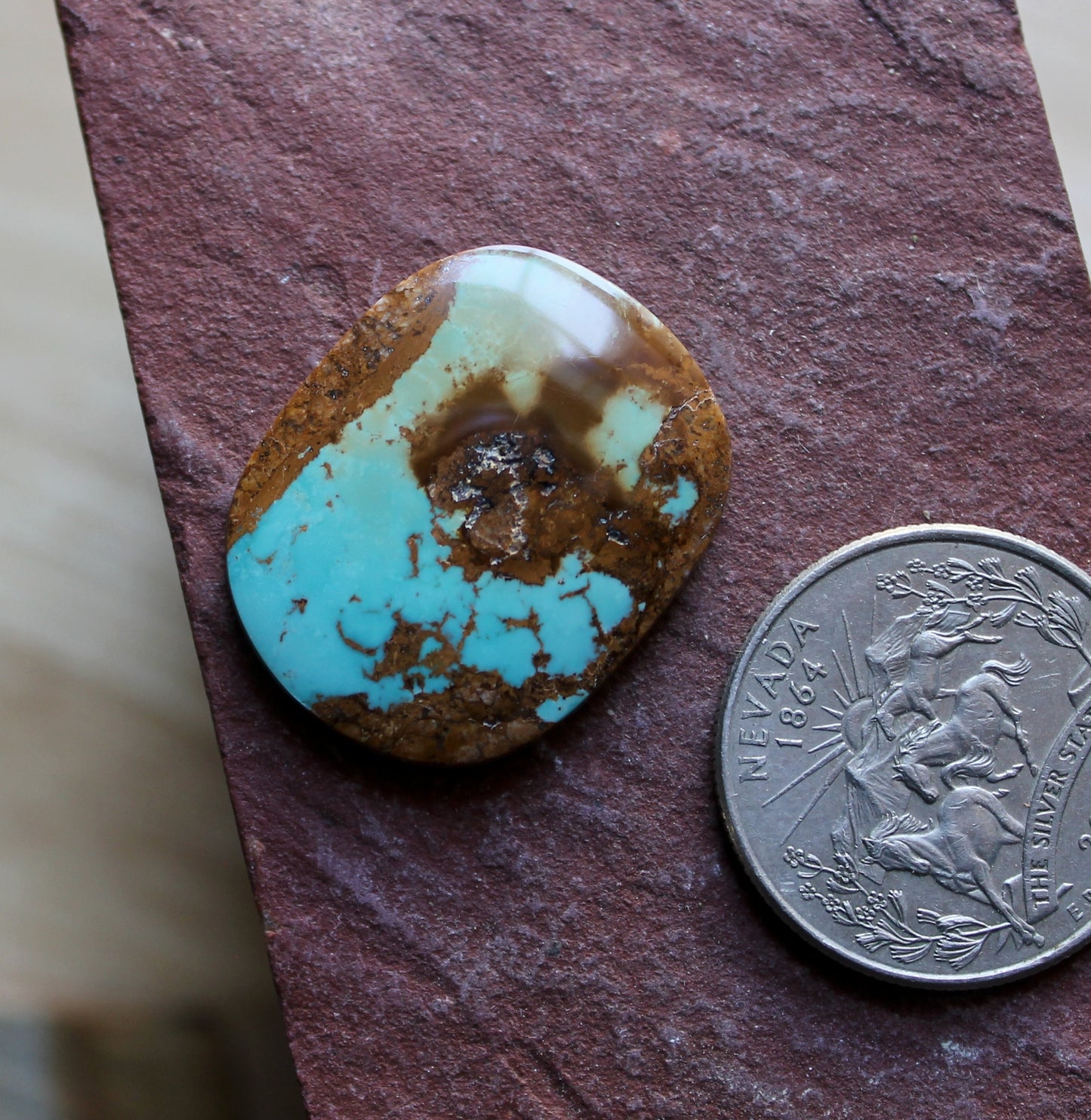 22 carat blue Stone Mountain Turquoise cabochon with red matrix