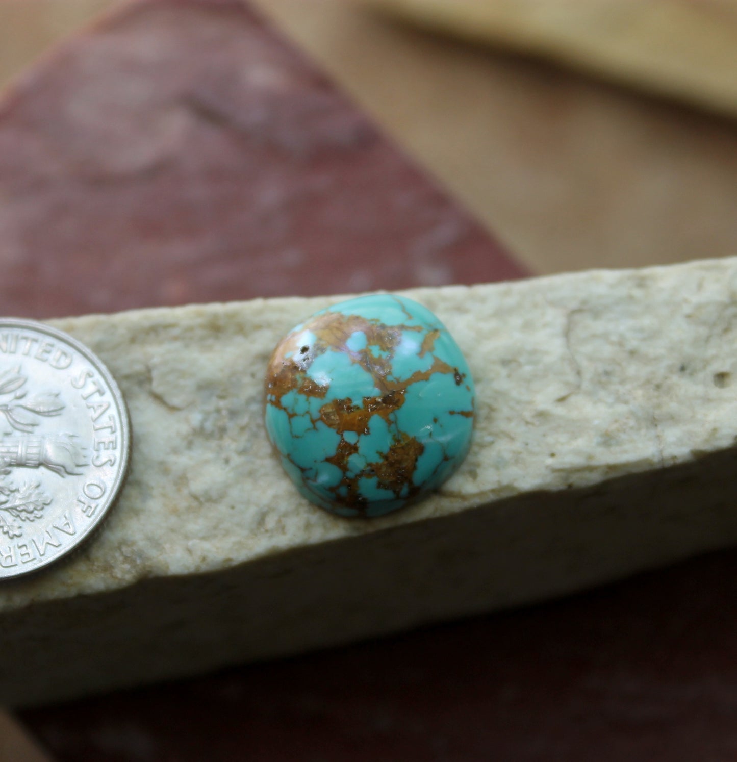 7 carat blue Stone Mountain Turquoise cabochon with a red matrix