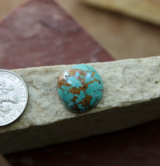 7 carat blue Stone Mountain Turquoise cabochon with a red matrix