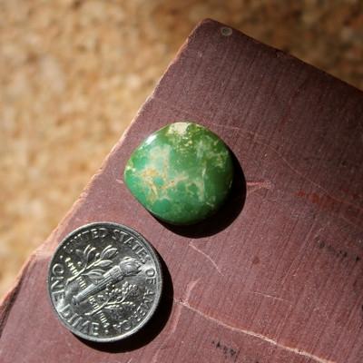 Green and brown with a tight corner on this Stone Mountain Turquoise cabochon