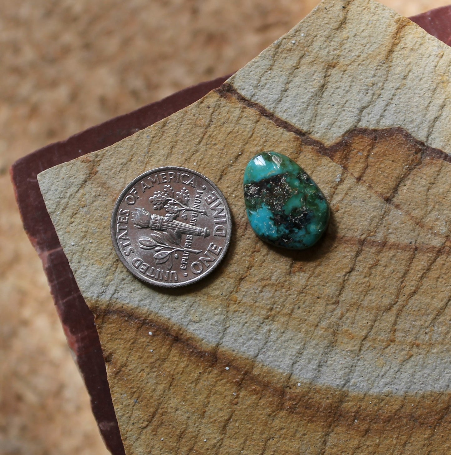5.8 carat natural McGinnis turquoise cabochon with dark matrix