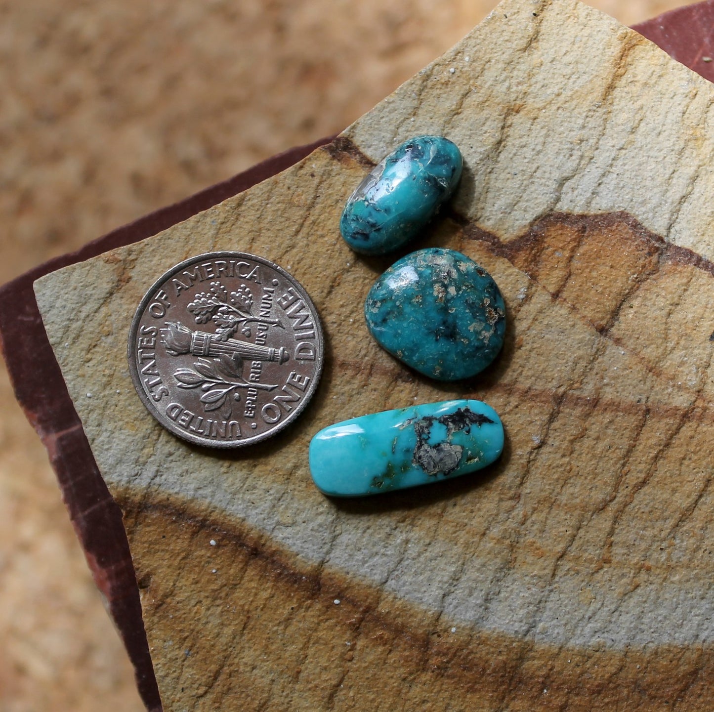 A mix of natural blue McGinnis turquoise cabochons