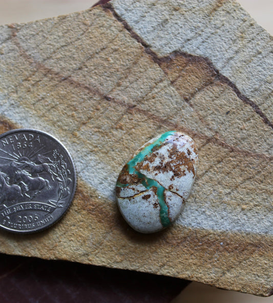 15 carat boulder-cut Stone Mountain Turquoise cabochon with a green river